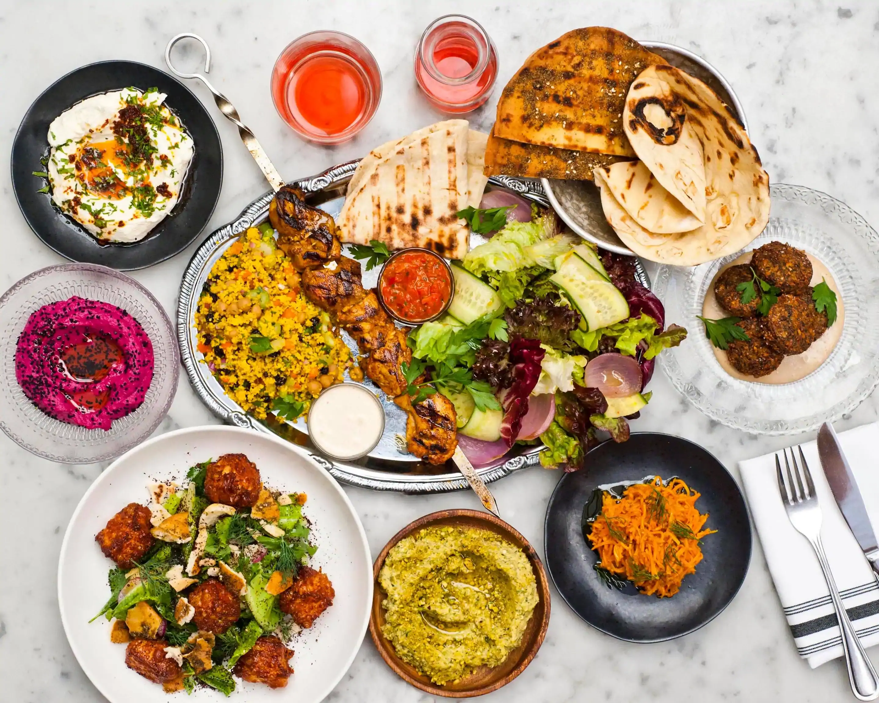 A spread of Lebanese and Mediterranean dishes from the Mazaj Mediterranean Cuisine menu in downtown Calgary
